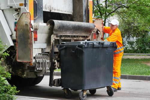 Workers loading items for transfer to a recycling facility
